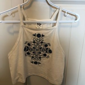 White tank with blue flowers.